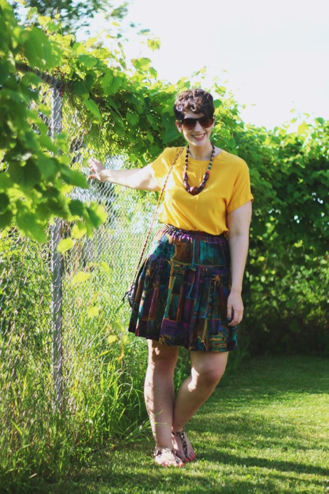 the outfit repeater hannah rupp yellow blouse multi-color skirt thrifted quilted purse beaded necklace