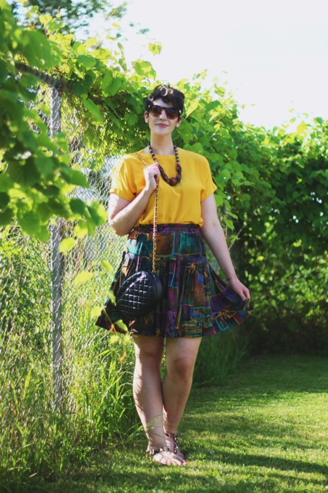 the outfit repeater hannah rupp yellow blouse multi-color skirt thrifted quilted purse beaded necklace