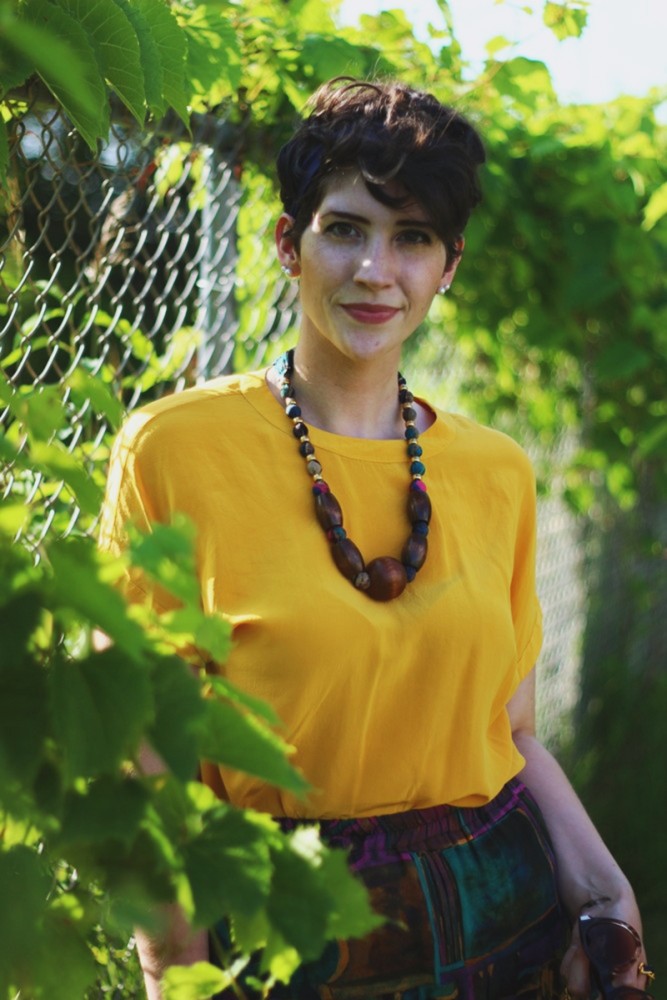 the outfit repeater hannah rupp yellow blouse multi-color skirt thrifted quilted purse beaded necklace