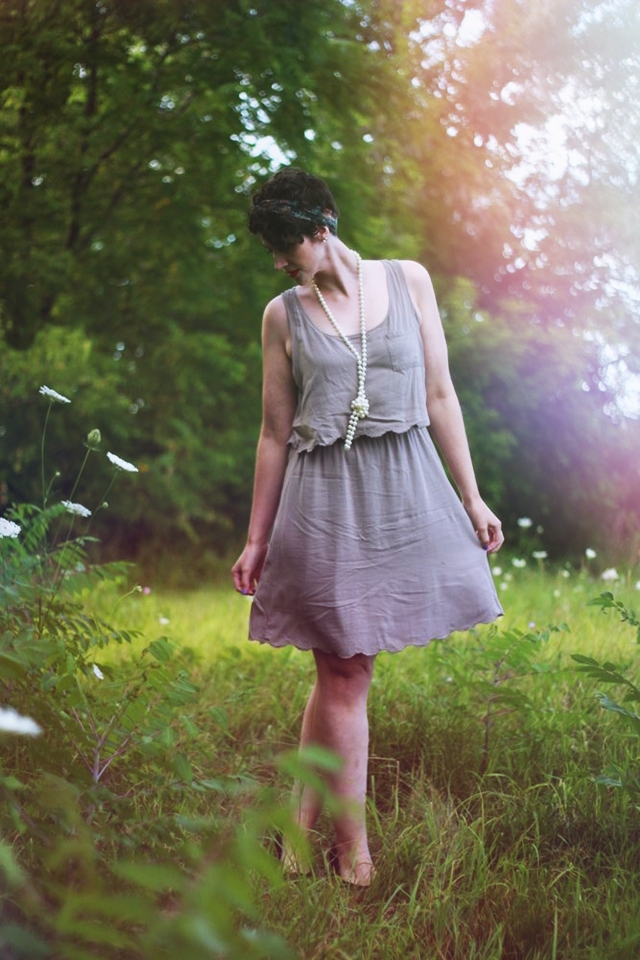 Vintage inspired outfit: Beige dress, long faux pearl necklace, vintage head scarf, red lipstick, black flats.