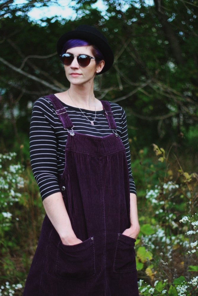 Overall Dresses Aren't Just For Homeschoolers Anymore | The Outfit Repeater Outfit: Black & white breton striped top, purple corduroy dress, black pork pie hat, reflective sunglasses