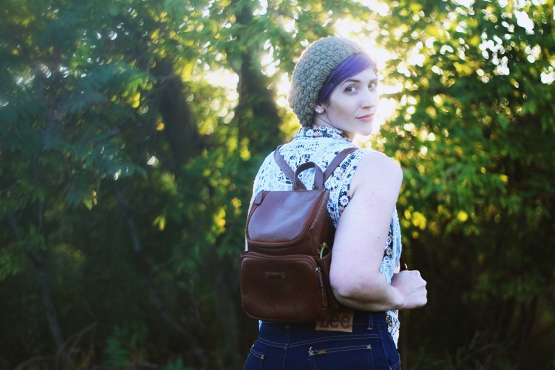 That '70s Outfit | The Outfit Repeater 1970s Inspired Outfit: Floral blouse, white lace vest, high waisted dark wash denim, high heels, mini brown backpack