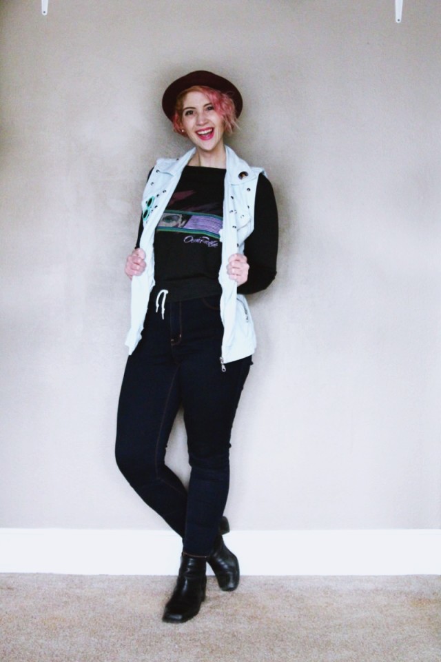 Crop Top in the Winter | The Outfit Repeater High waisted jeans, vintage sweatshirt, denim studded vest, black heeled boots, purple bowler hat