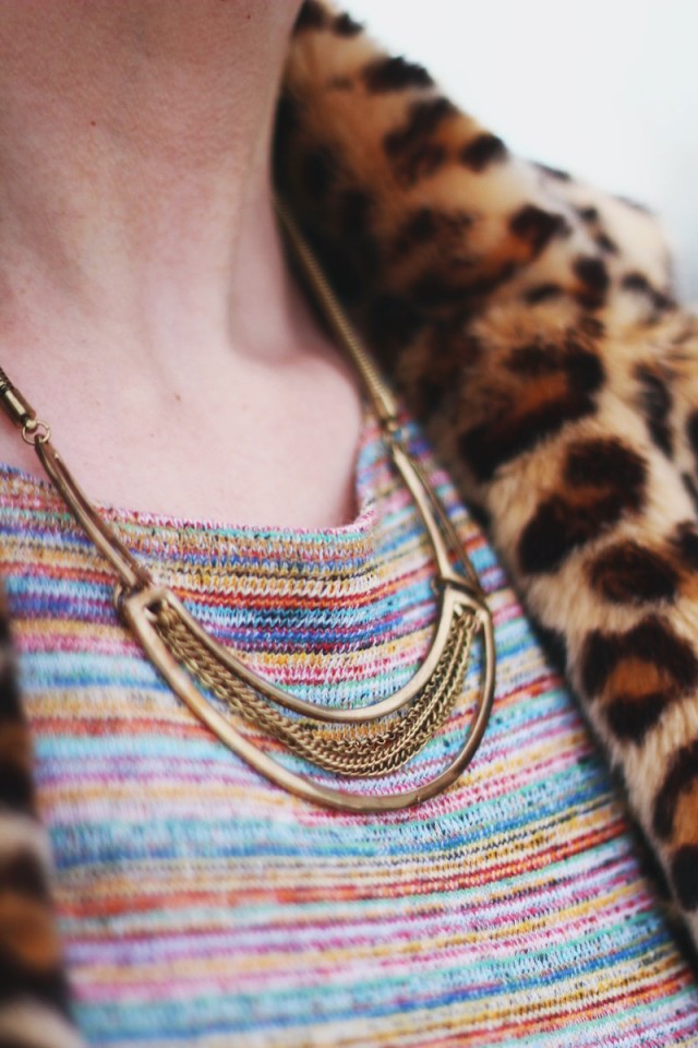 Outfit details: gold statement necklace, striped crop top, leopard print coat
