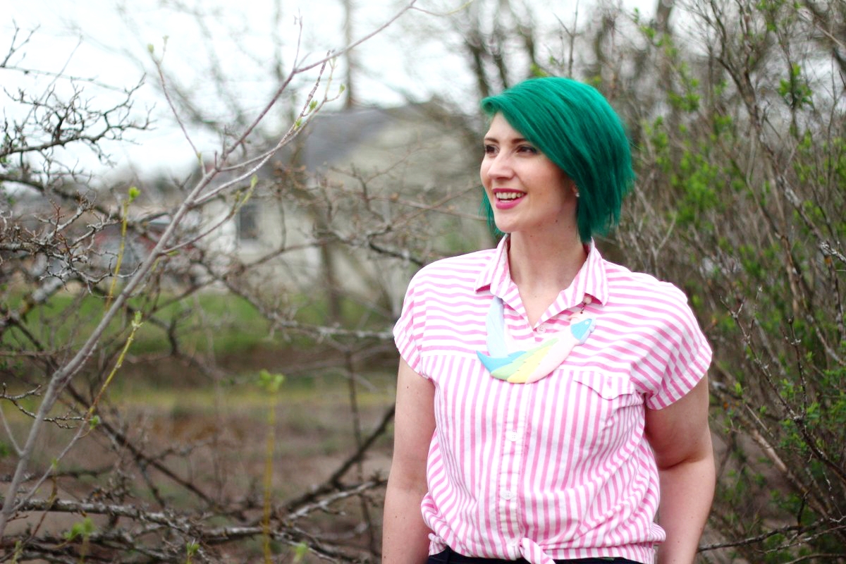 Outfit: pink striped button up, a statement necklace in the shape of a parrot, green hair