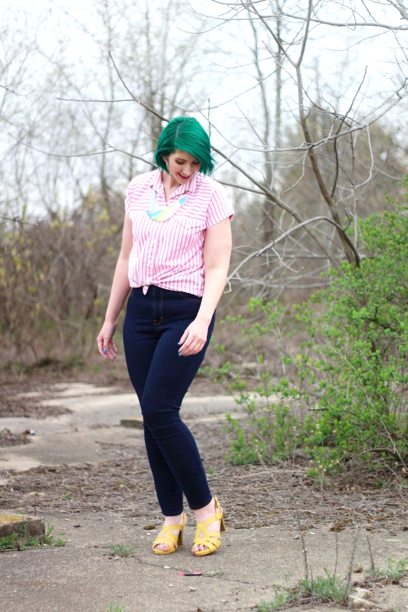 Outfit: pink striped button up, dark wash high waisted jeans, yellow high heels, a statement necklace in the shape of a parrot, green hair