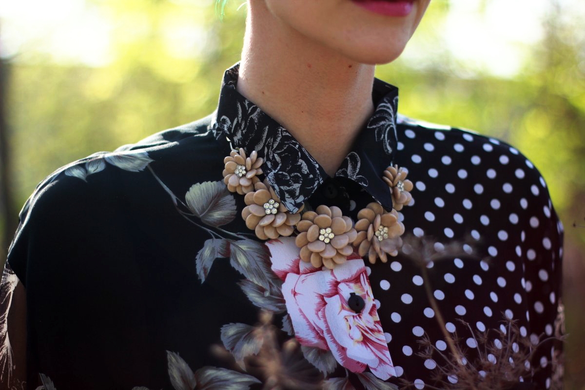 Mother's Day outfit details: pattern mixing button up blouse, beige flower necklace