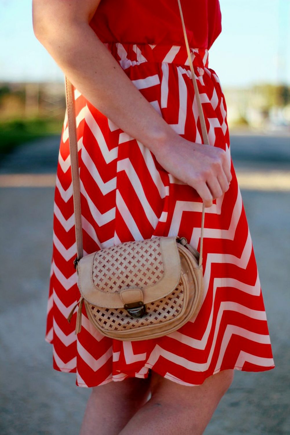 Outfit details Outfit: Vintage red top, thrifted orange chevron skirt, beige cross body purse