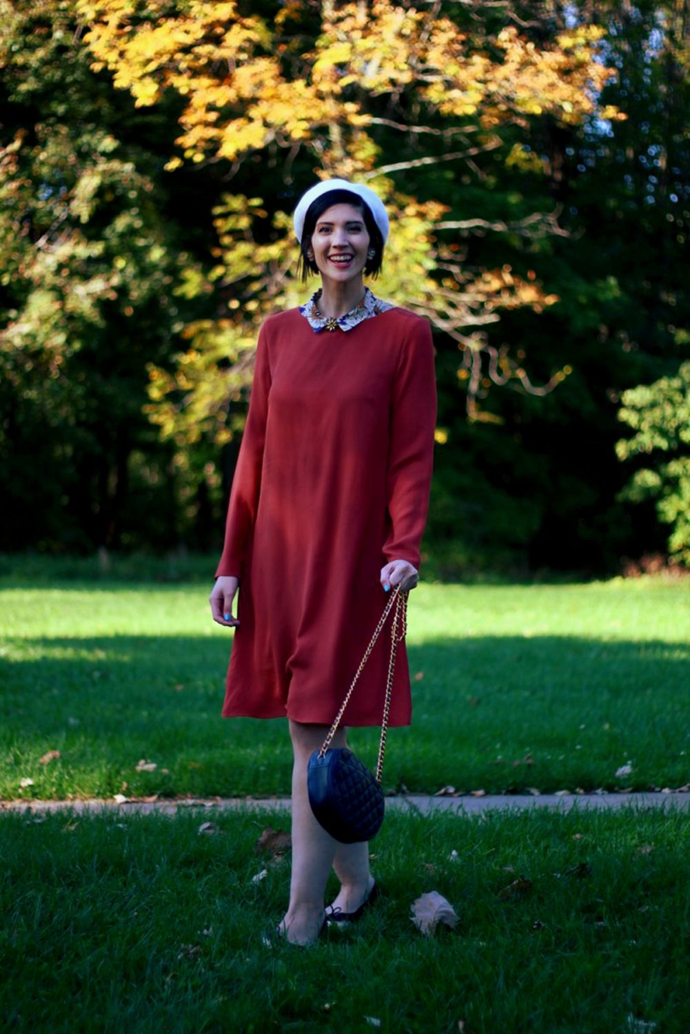 Outfit: Orange retro style dress, flower collar, jewel flower brooch, cream colored beret, navy purse, brown flats