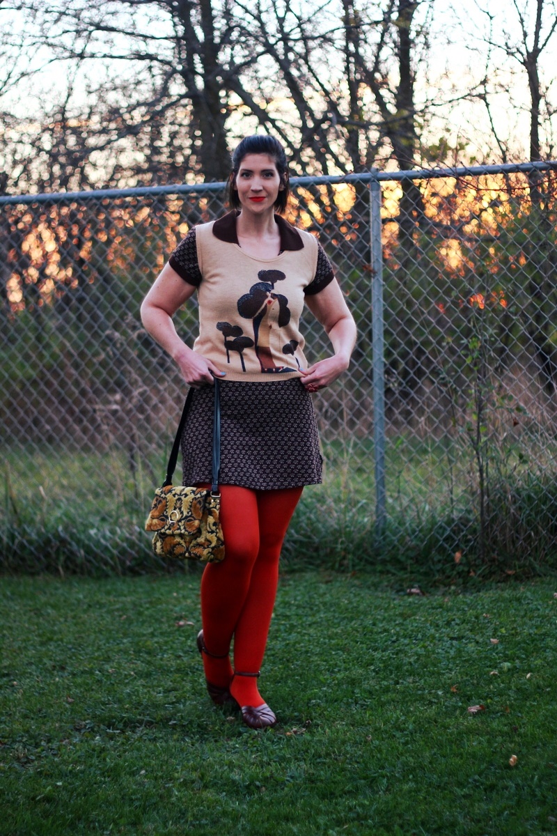 A Fun Way To Wear a Vintage Sweater Vest | www.theoutfitrepeater.com Outfit: Brown mini dress, vintage vest, orange lipstick, orange tights, ugly yellow purse, brown chunky heels