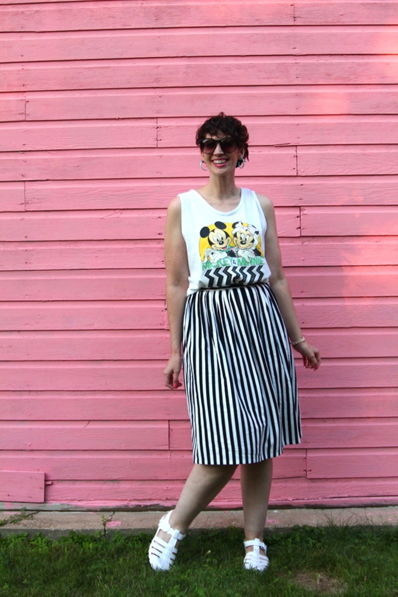 1980s outfit post striped skirt, mickey and minnie tank top, vintage sunglasses, jelly sandals, retro earrings
